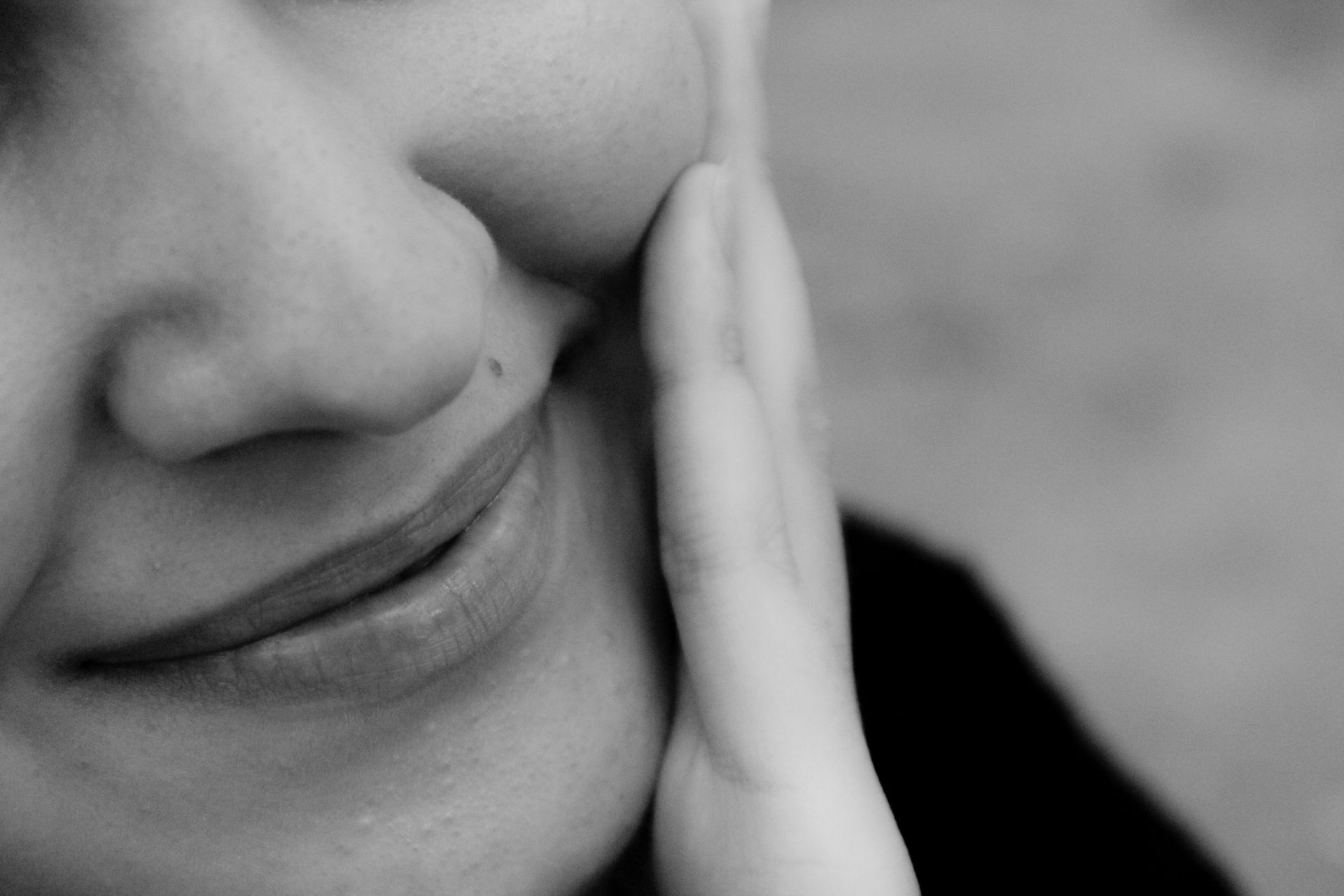 Woman With Clear Skin Touching Face