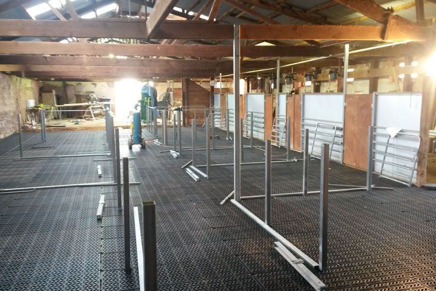 A large room with a lot of fences in it