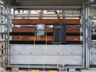 A fence with a remote control attached to it.