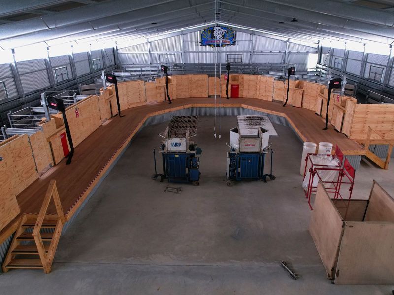 An aerial view of a large building with wooden walls