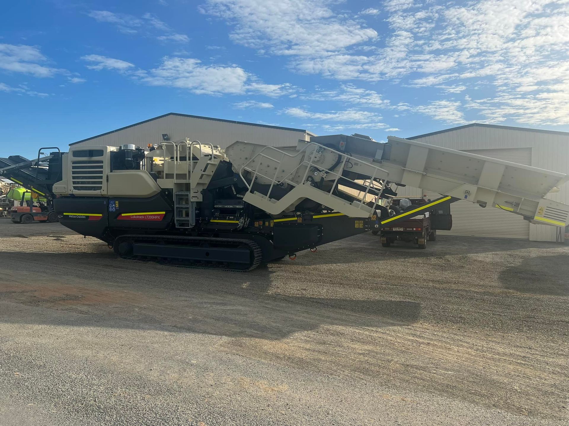 Mobile Aggregate Processing Machine in A Gravel Lot Under a Blue Sky — Barlow's Earthmoving in Emu Park, QLD