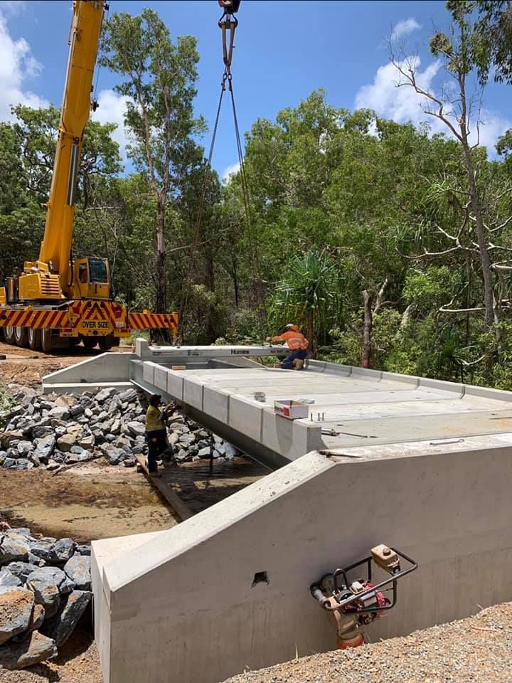 Crane Lifting Concrete Bridge Section; Construction Workers on Site — Barlow's Earthmoving in Coorooman, QLD