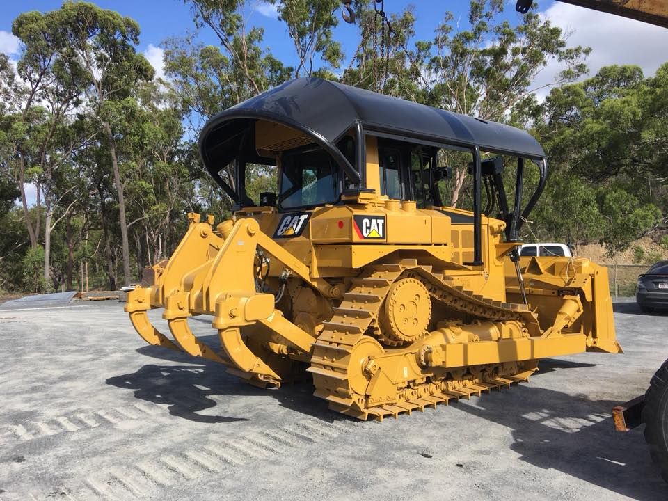 Yellow Caterpillar Bulldozer with Protective Canopy on A Gravel Surface — Barlow's Earthmoving in Coorooman, QLD