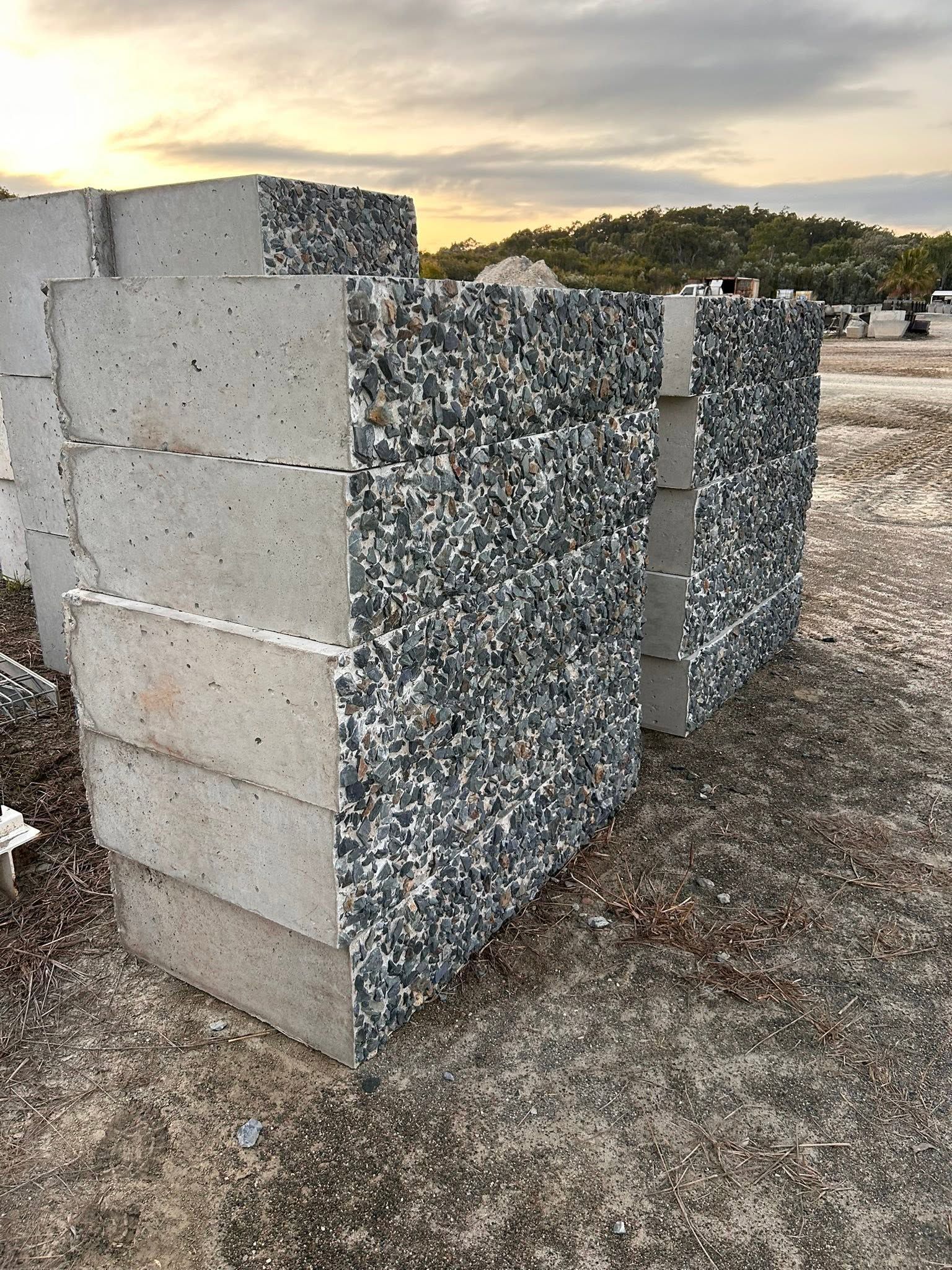 Stacked Gabion Wall Blocks at a Gravel Yard During Sunset — Barlow's Earthmoving in Coorooman, QLD