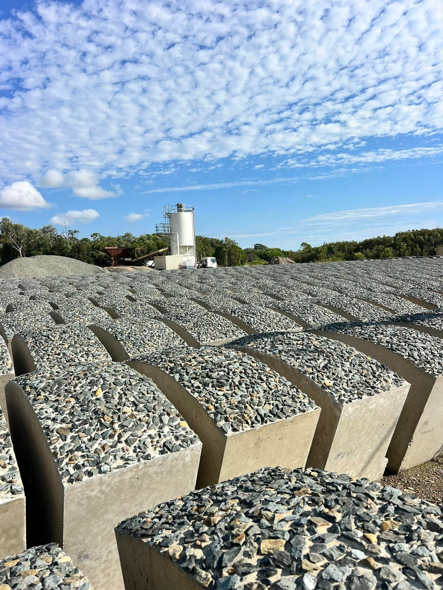 Rows of Gray and Tan Memorial Stones Under a Blue Sky With Scattered Clouds — Barlow's Earthmoving in Coorooman, QLD