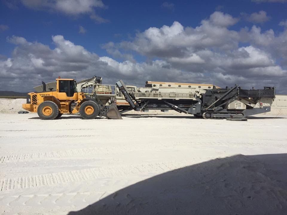 Yellow Construction Vehicle With Conveyor on a White Sandy Surface — Barlow's Earthmoving in Coorooman, QLD