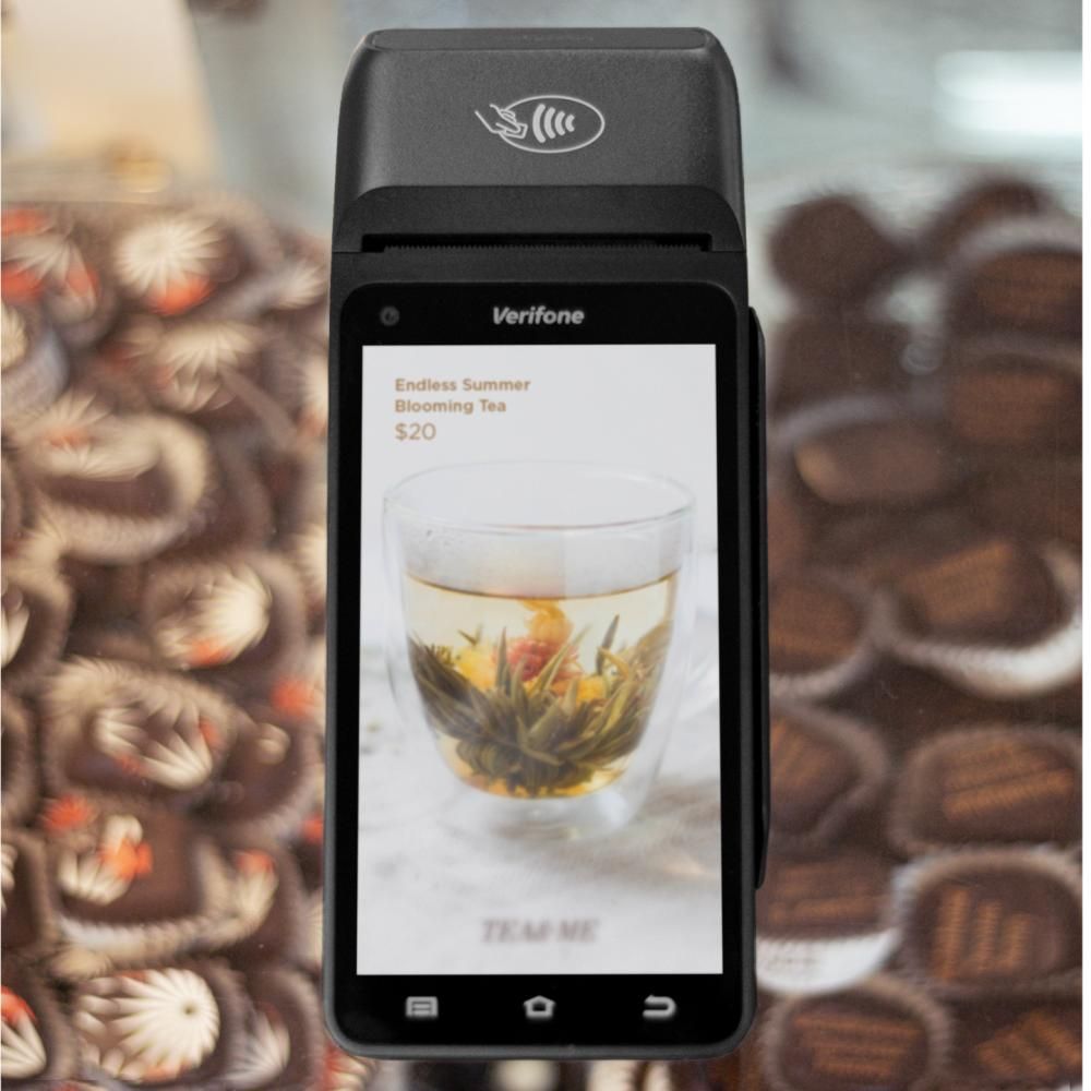 A phone with a picture of a cup of tea on the screen