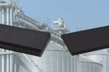 Black conveyor belts in front of an agricultural silo structure.