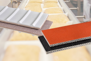 Close-up of industrial conveyor belt materials in various colors: white, brown, red, and black.