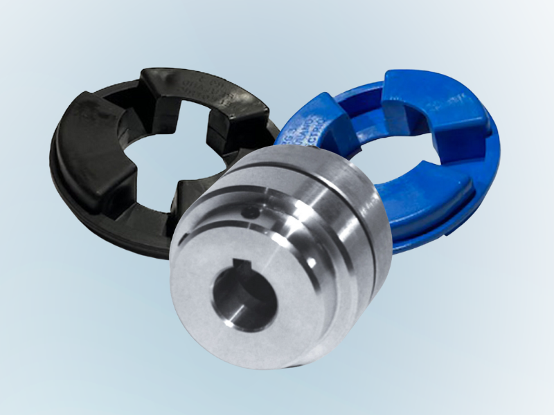 Three shaft couplings: center metallic, with black and blue outer coupling elements.