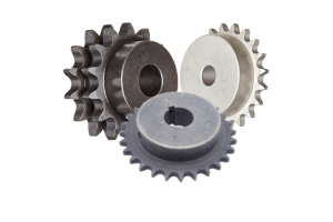 Four metal sprockets of varying sizes and colors on a white background.