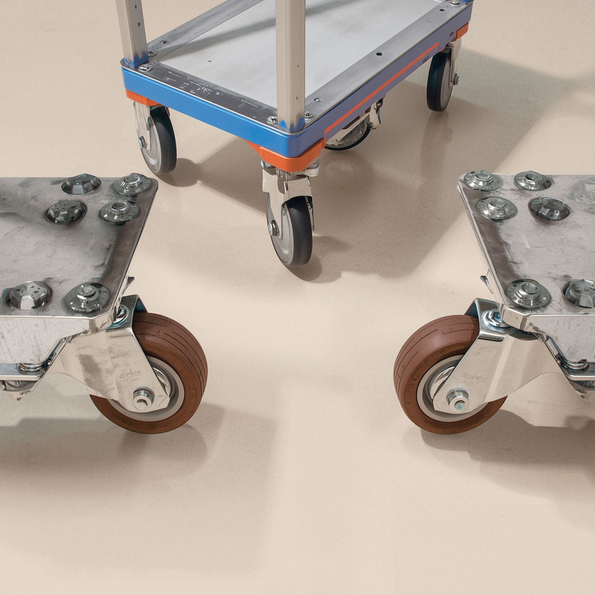 Heavy-duty casters with polyurethane wheels mounted on steel brackets for industrial equipment