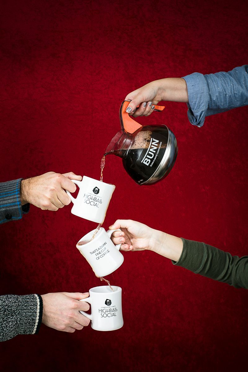 Twin Peaks-themed photo shoot with coffee cups, carafe and hands. Product photography in the studio for Stonecutter Spirits by JAM Creative.