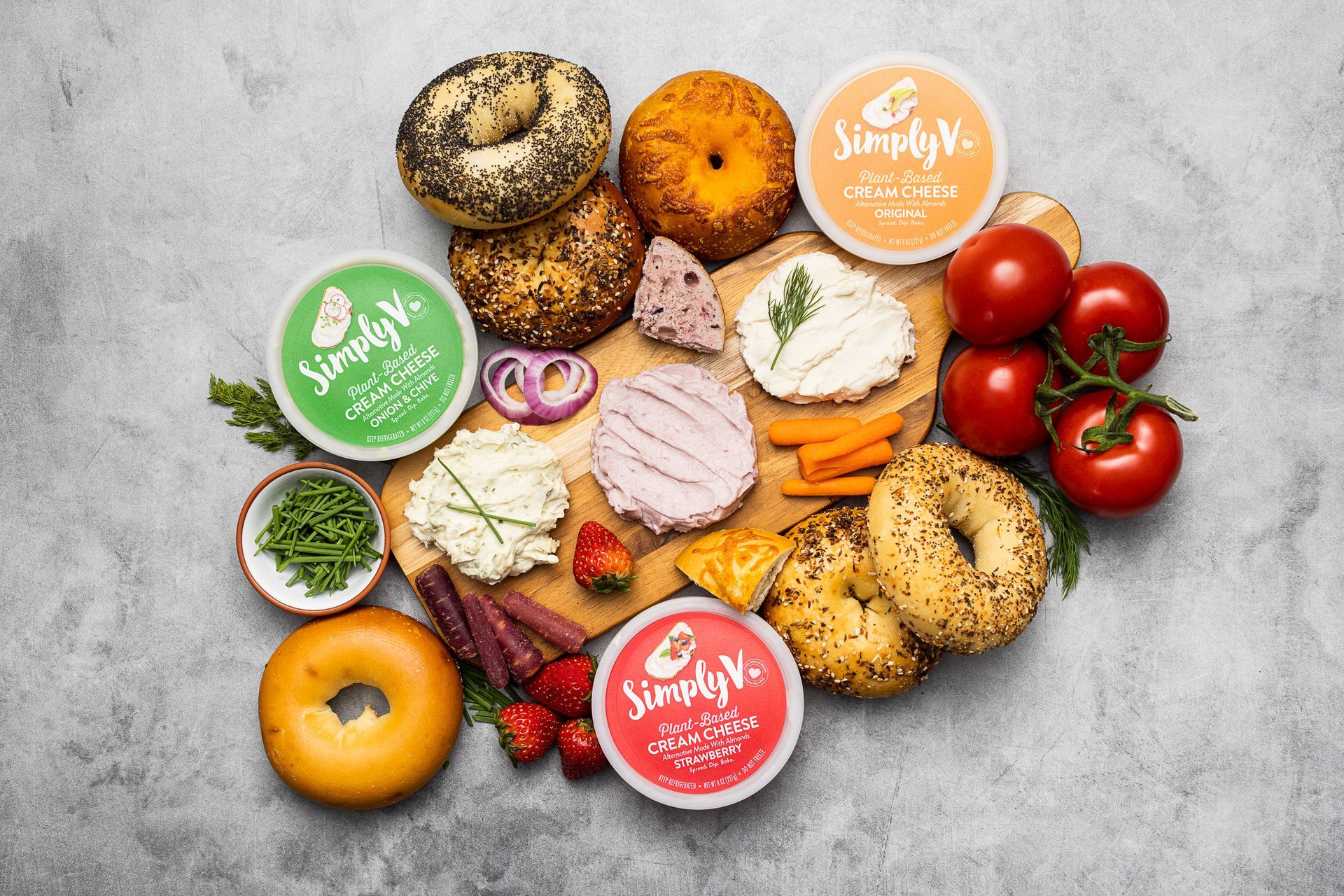 Lifestyle product food photography of Simply V cream cheese and bagels. By commercial photographers in Burlington.