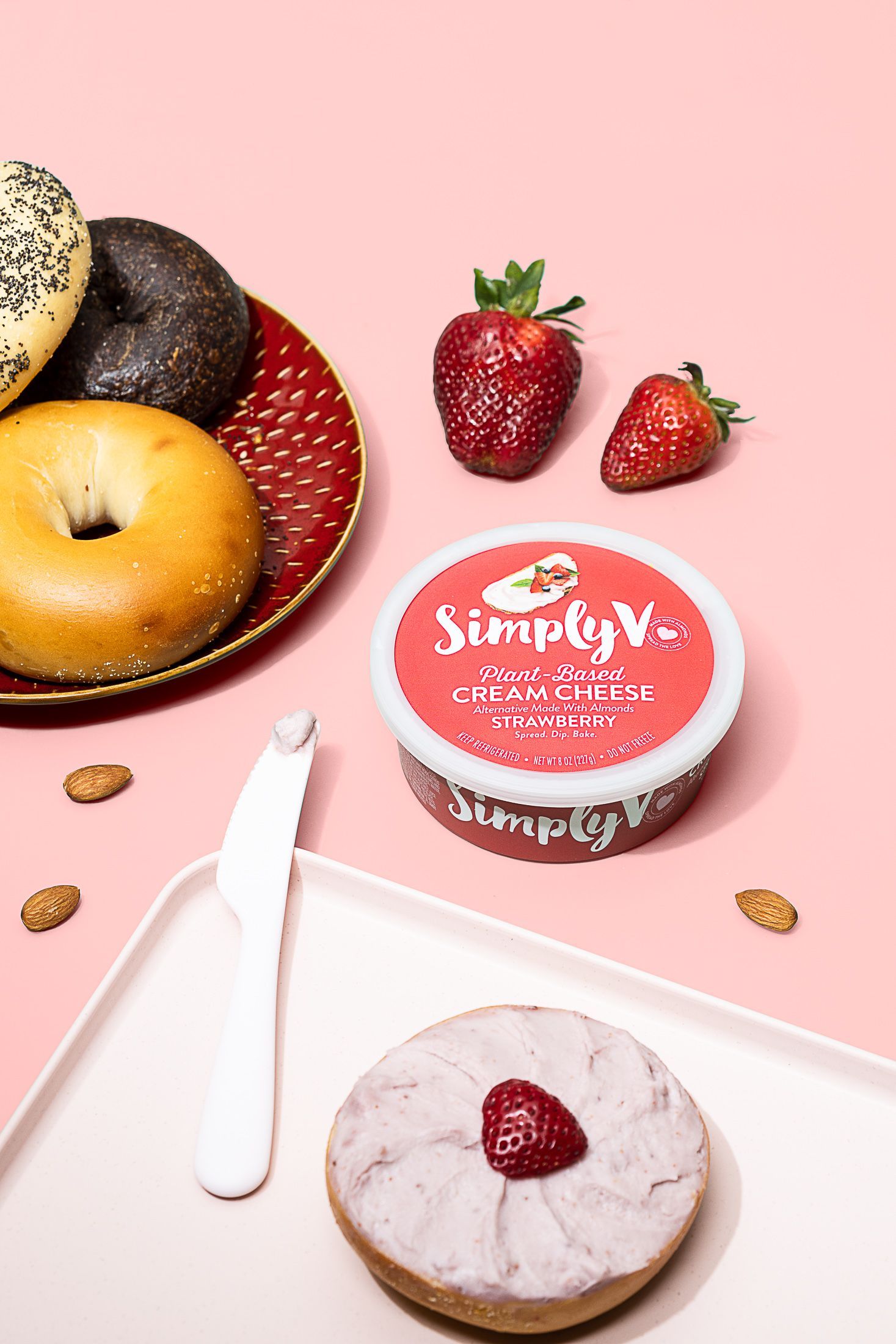 Lifestyle product food photography of Simply V strawberry cream cheese and bagels. By commercial photographers in Burlington.