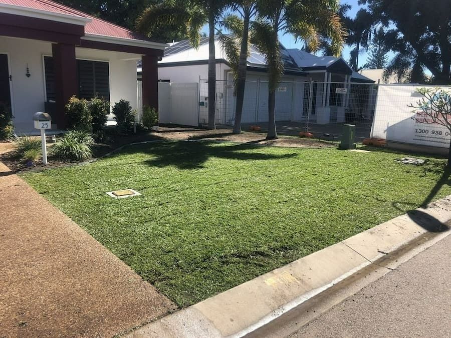 Green Lawn in Front of A House, Sidewalk on The Left, Street on The Right — Top Notch Turf in Rasmussen, QLD