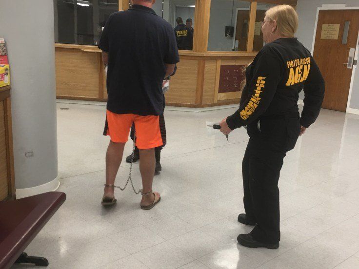 Police Department With Man On Cuffs And Police Lady — Mississippi Gulf Coast — Ben The Bondsman Police Department With Man On Cuffs And Police Lady — Mississippi Gulf Coast — Ben The Bondsman