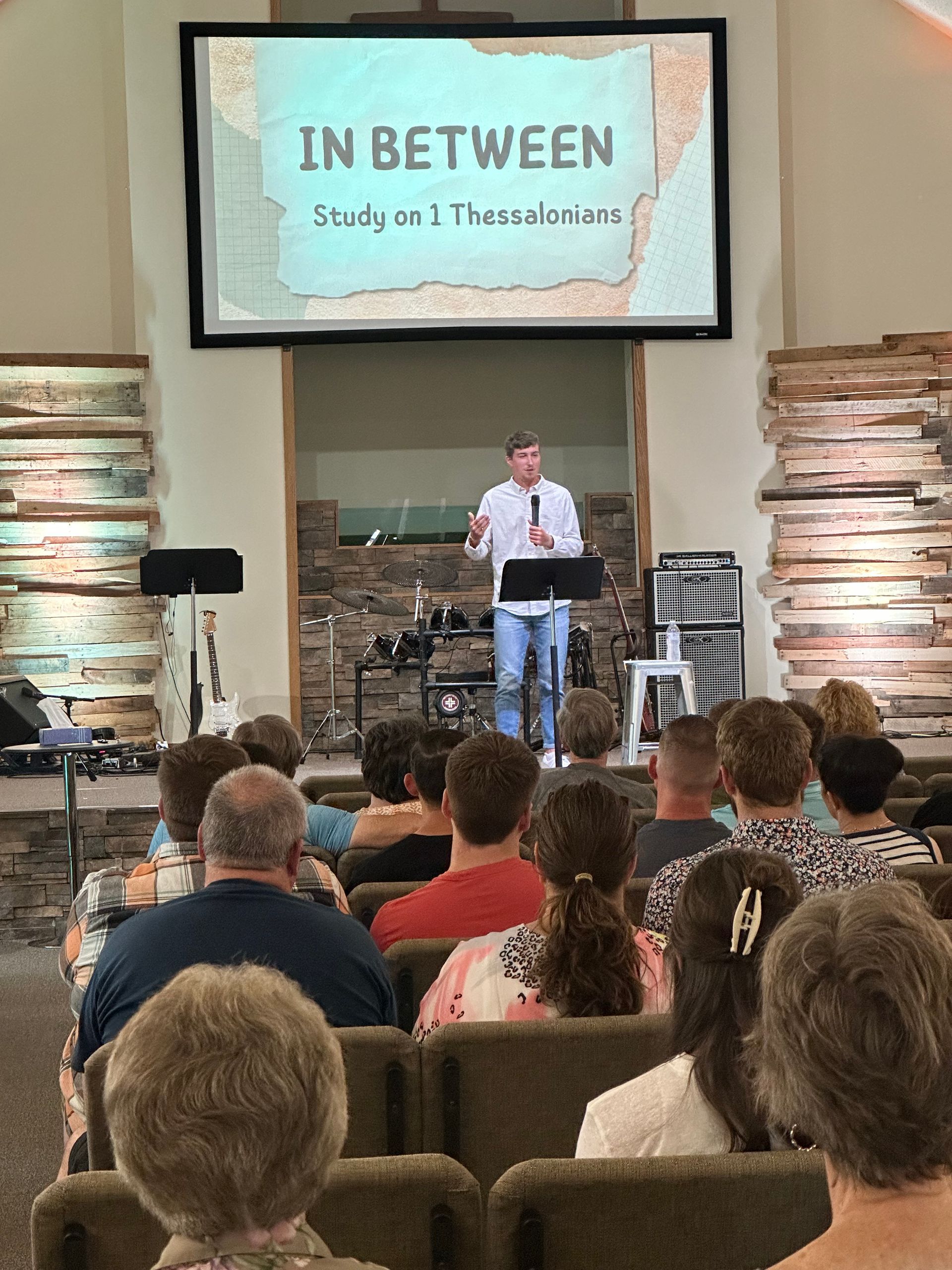 Speaker at church podium with 