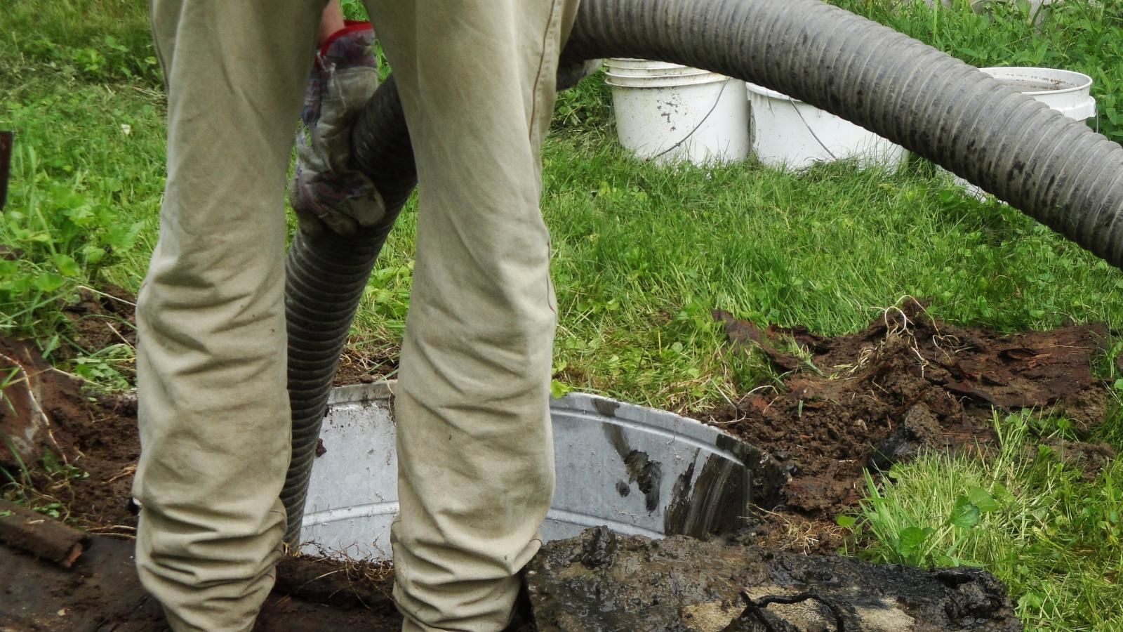 Worker setting up pumping system.