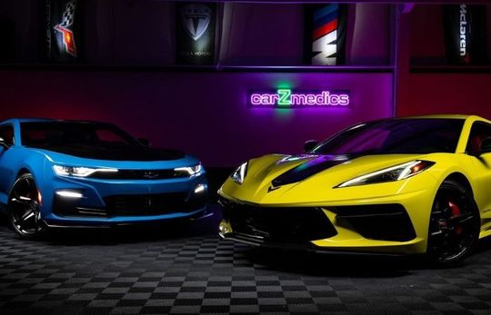 A Chevy Camaro and Corvette in a photoshoot after getting ceramic coatings.