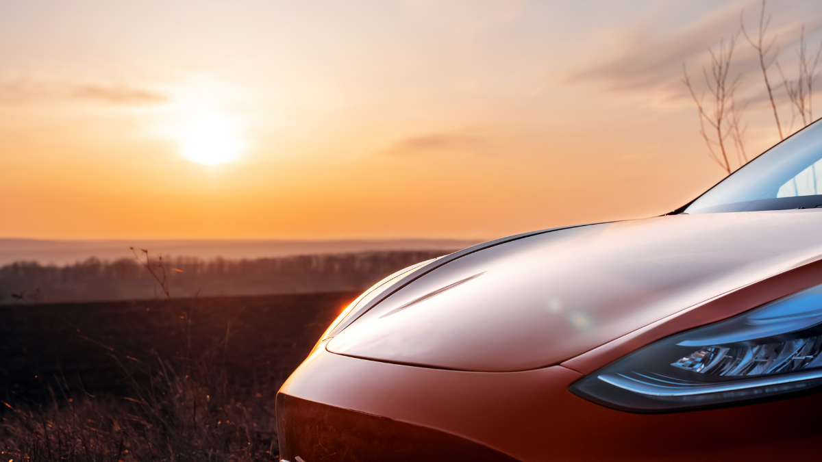 Tesla with Paint Protection in front of a Sunset 
