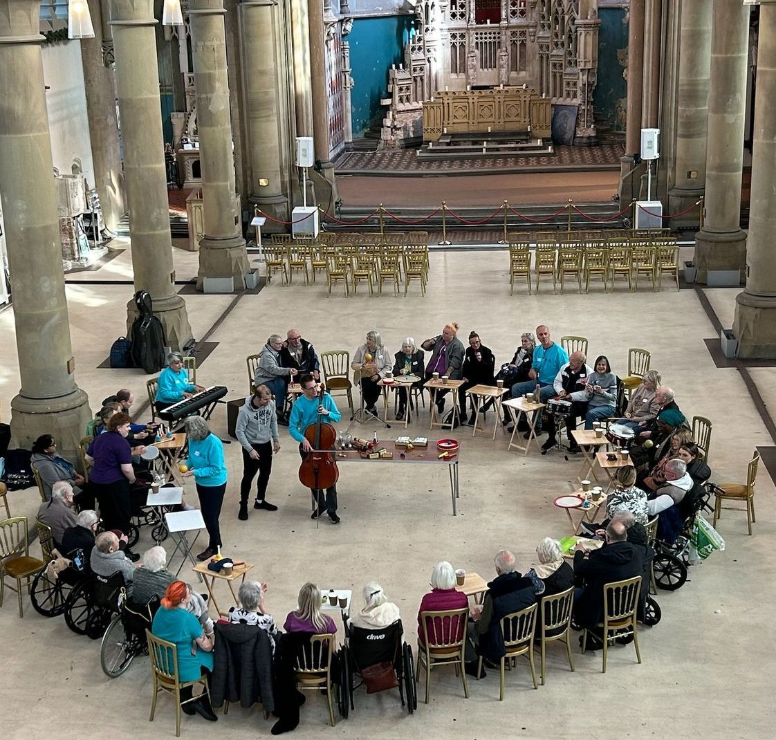 A group of people are sitting in a circle in a church