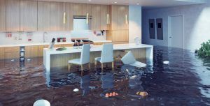 Flooded modern kitchen and dining area with water covering the floor