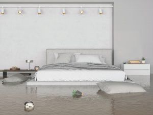 Minimalist bedroom with a white bed, floating shelf lights, and a mirror-like reflective floor.