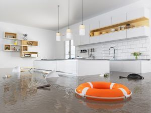 Flooded modern kitchen with floating orange life ring and overturned chairs