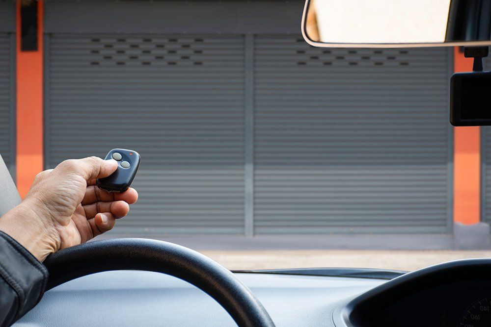 Person Using Garage Remote — Columbus, OH — Ohio Commercial Door