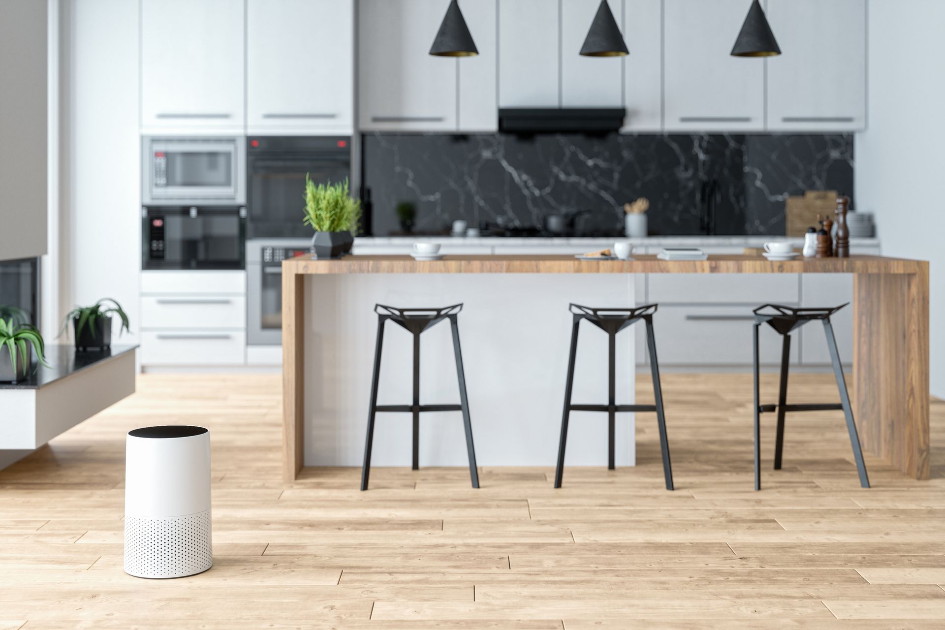 A modern kitchen with white cabinets , a wooden counter top , stools and a trash can.