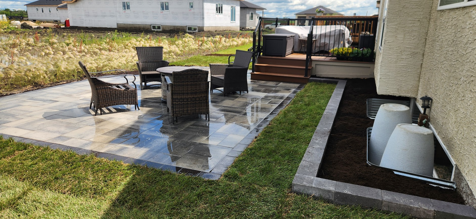 Stone patio with seating and deck