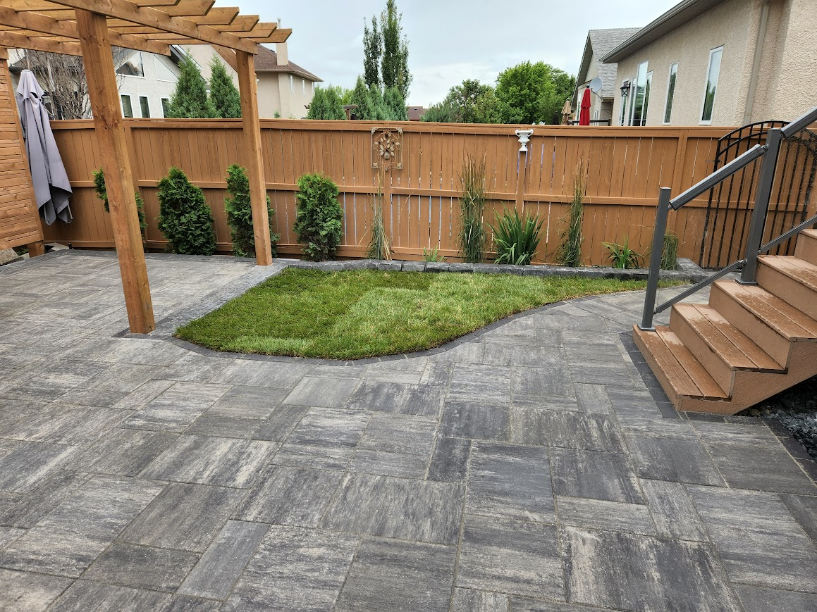 Patio with a pergula and landscaping