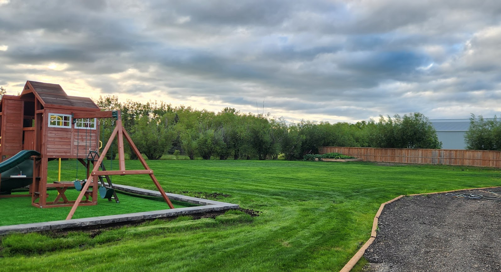 Lush green lawn with playstructure