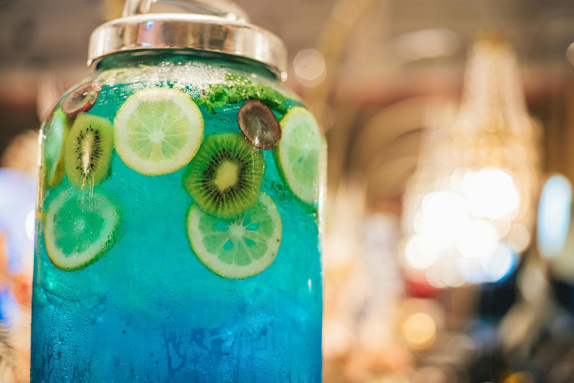 Blue drink dispenser with fruit slices.