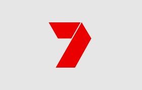 Red stylized number 7 logo on a light gray background