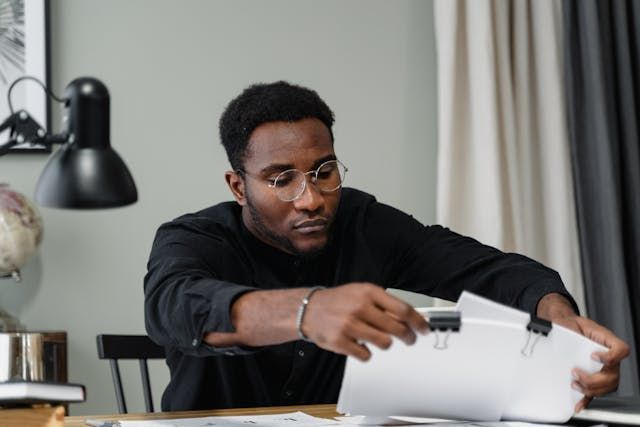 a person looking at documents