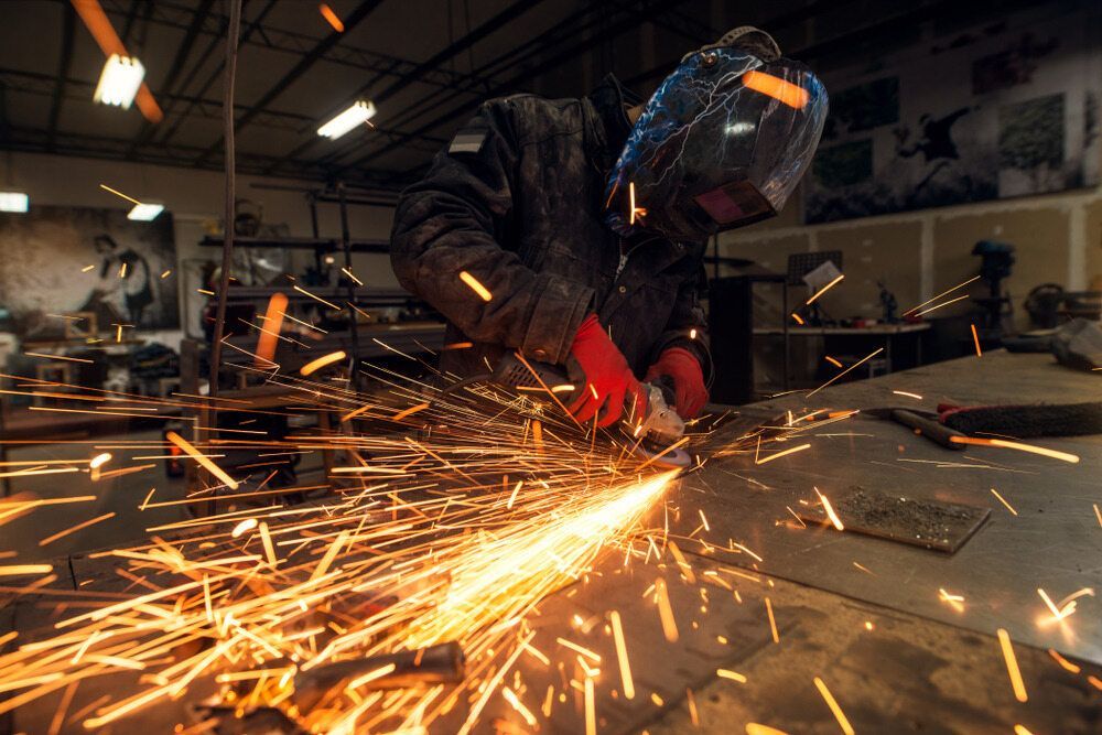 Skilled Craftsman Grinding And Polishing Metal - Skilled Fabrication on the Cassowary Coast