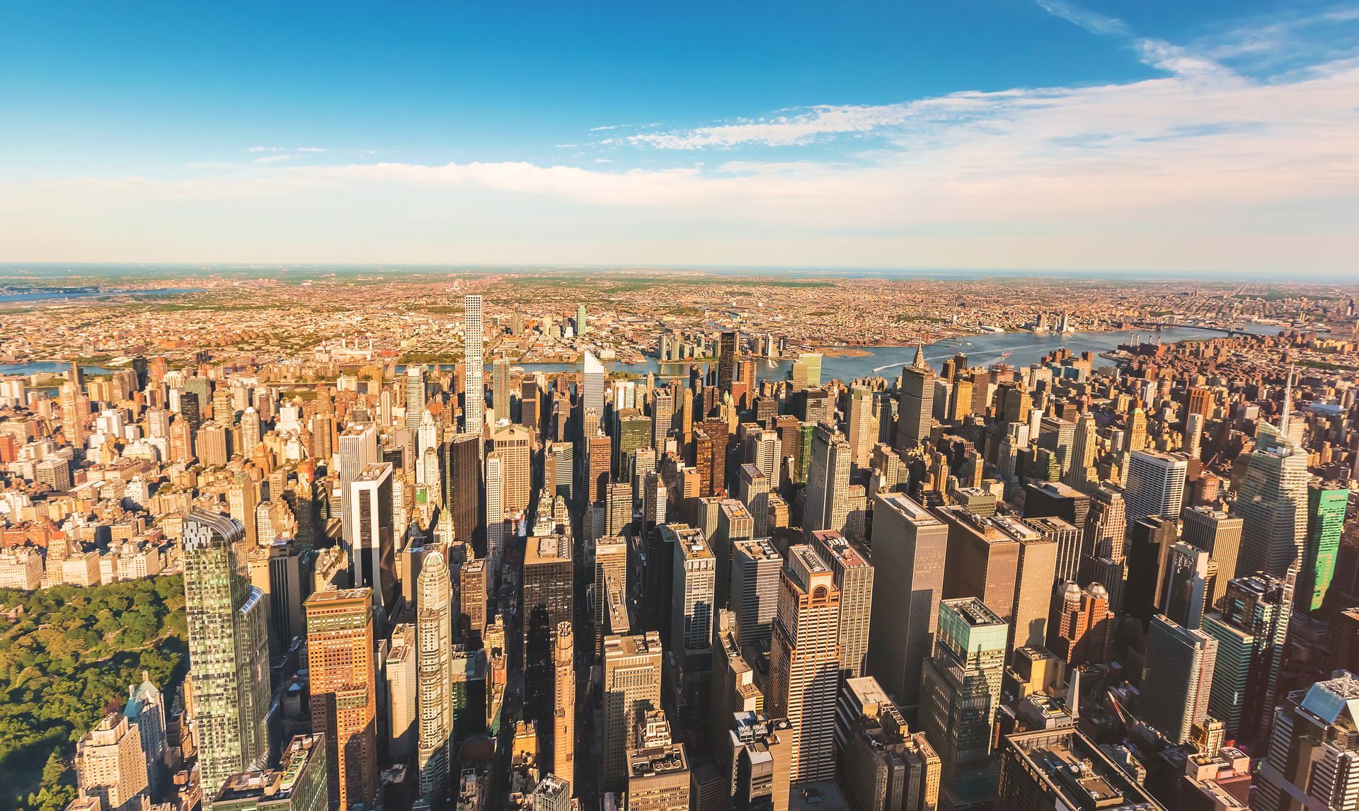 Aerial view of Manhattan skyline with One World Trade Center centered on a clear day