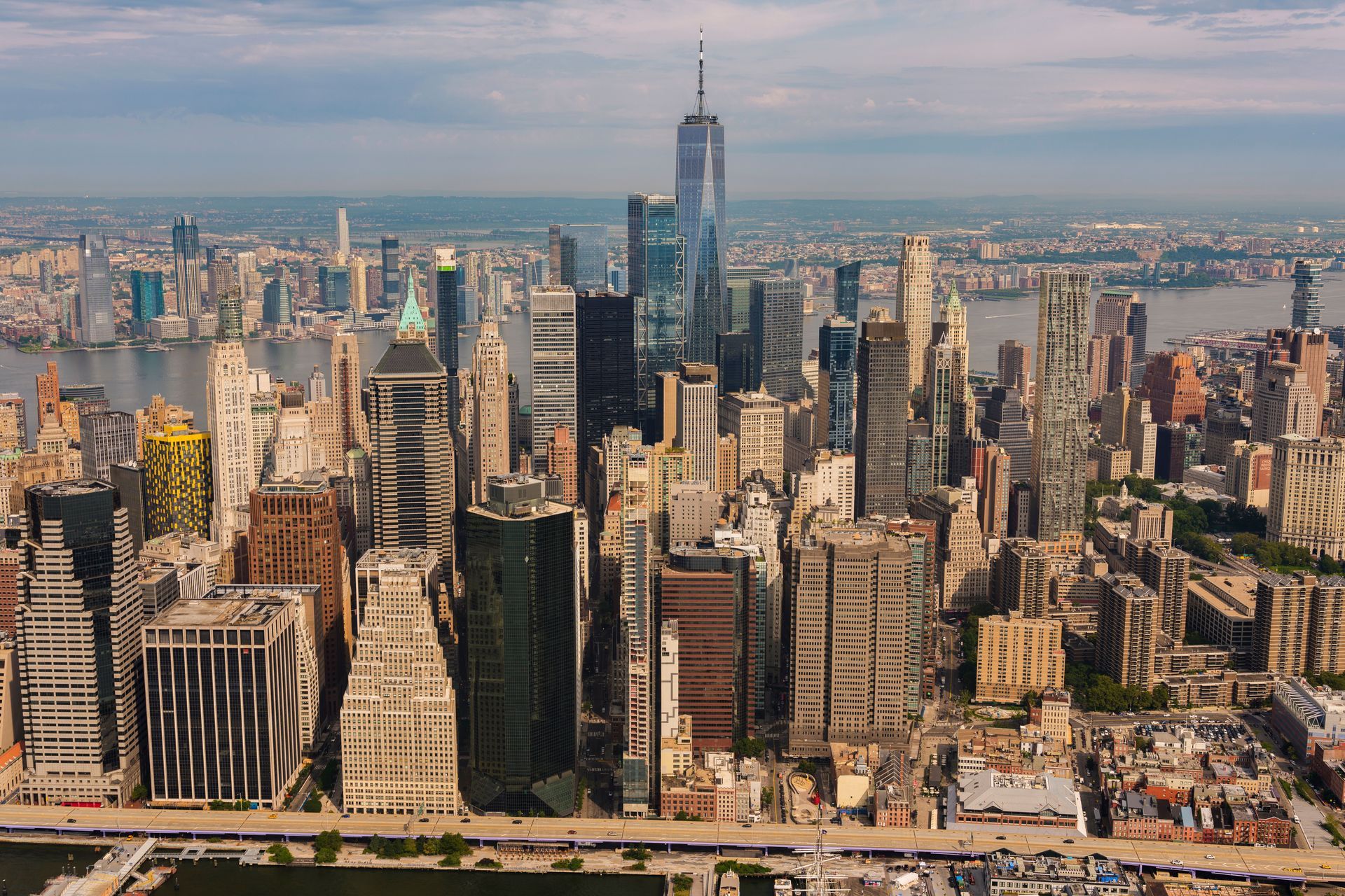Aerial view of Manhattan skyline with One World Trade Center centered on a clear day