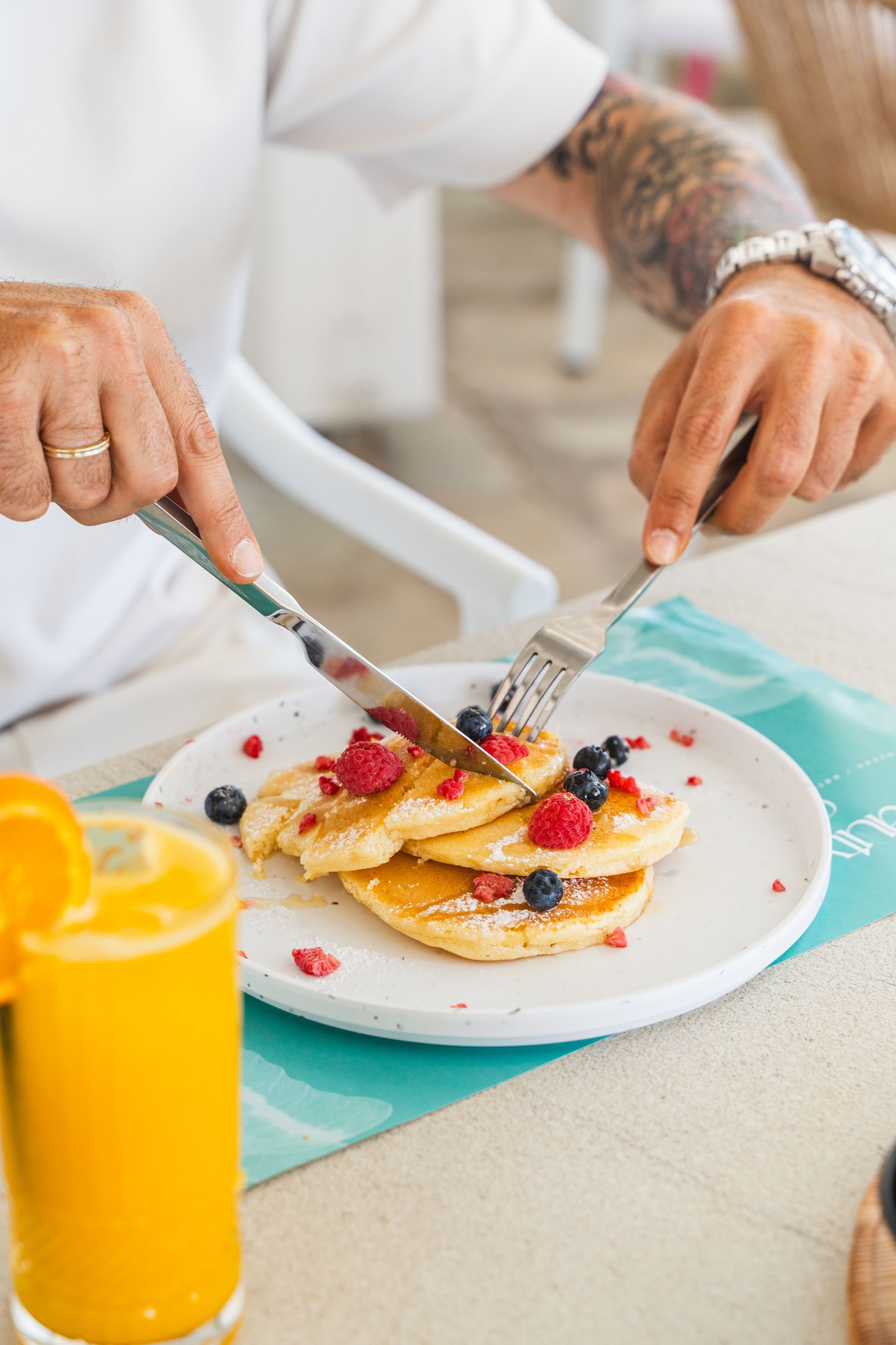 Classic pancakes with fruits and maple syrup for all day brunch  at Beauty Cafe Mykonos