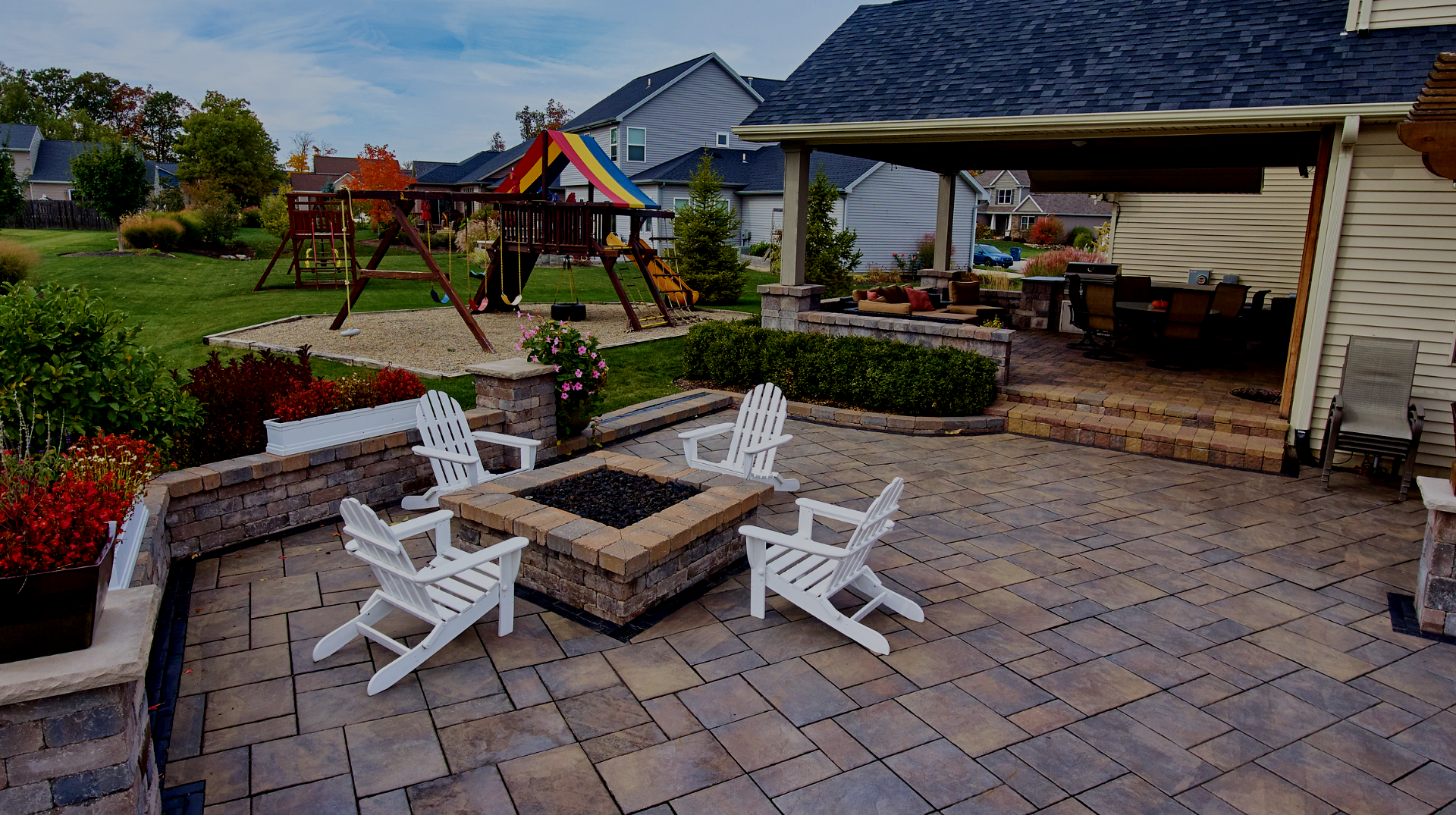 There is a fire pit in the middle of the patio.