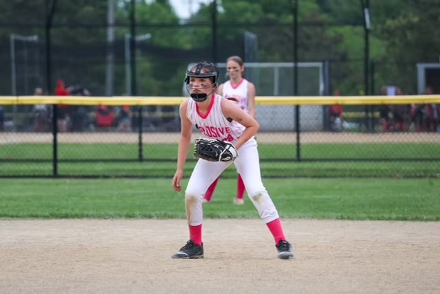 Explosive Fastpitch softball player during a game