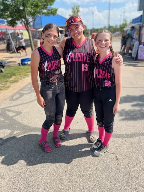 Three Explosive Fastpitch softball players