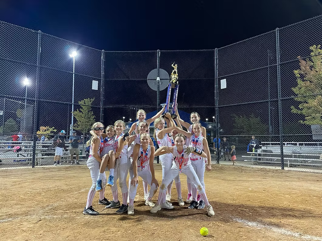 Explosive Fastpitch softball team celebrating a championship