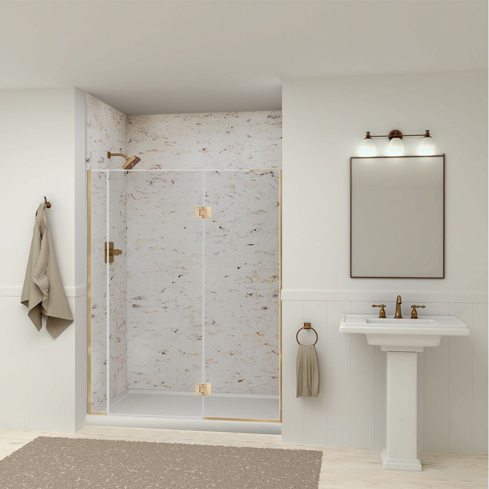 Modern white bathroom with glass shower, pedestal sink, mirror, and beige rug