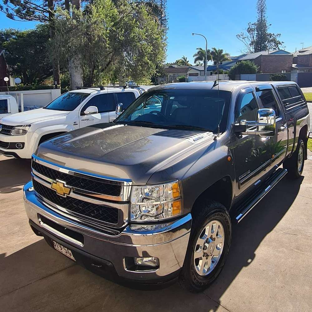 A Silver Chevrolet Truck is Parked in a Driveway — Remedy Mobile Car Detailing in Gold Coast, QLD
