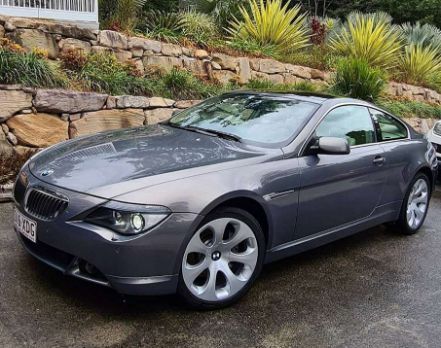 A Gray Bmw is Parked in Front of a Stone Wall — Remedy Mobile Car Detailing in Gold Coast, QLD