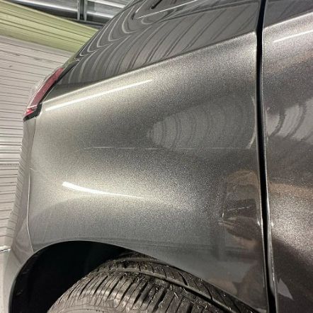 Close-up of a Gray Car's Side, Showing Its Rear Wheel — Remedy Mobile Car Detailing in Mermaid, QLD