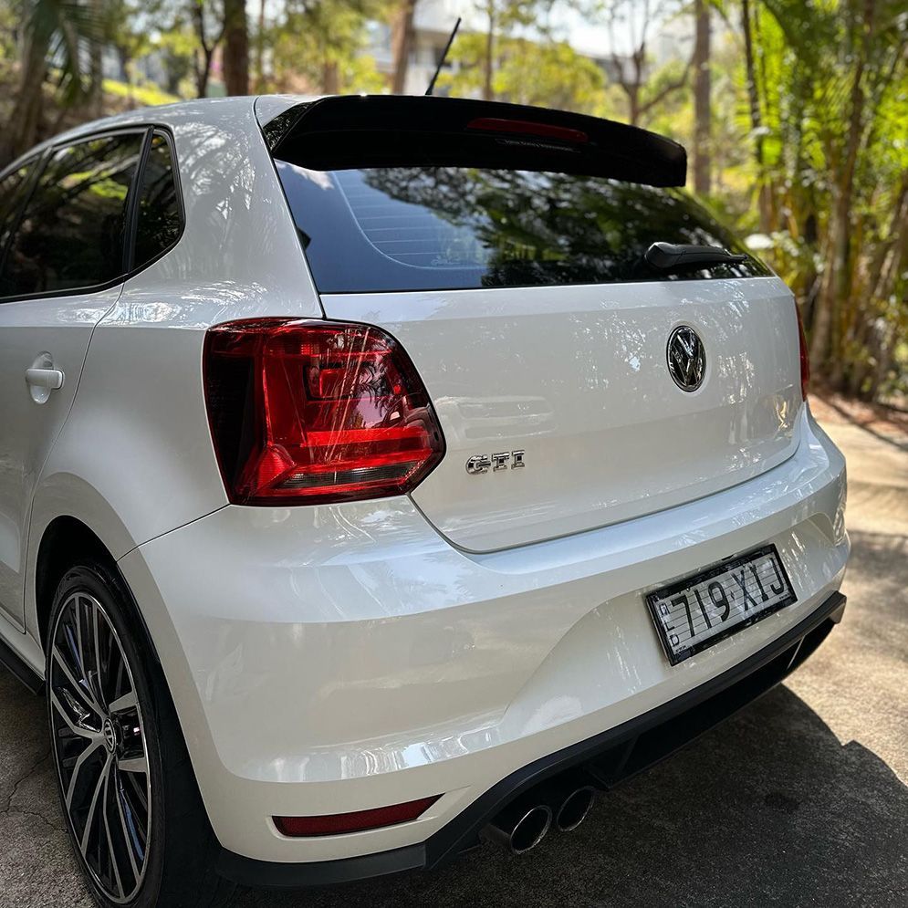 White Volkswagen Polo GTI Parked Outdoors With Black Spoiler and Taillights — Remedy Mobile Car Detailing in Carrara, QLD